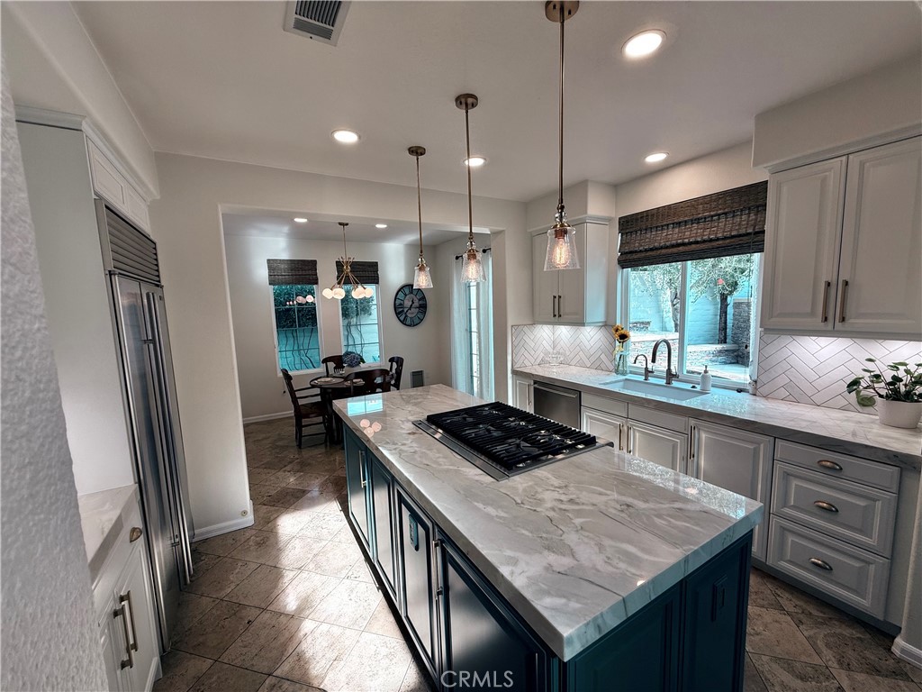 32 Marisol Newport Coast, CA 92657 - Photo 15 of 61 a kitchen with stainless steel appliances granite countertop a stove a refrigerator a sink and dishwasher