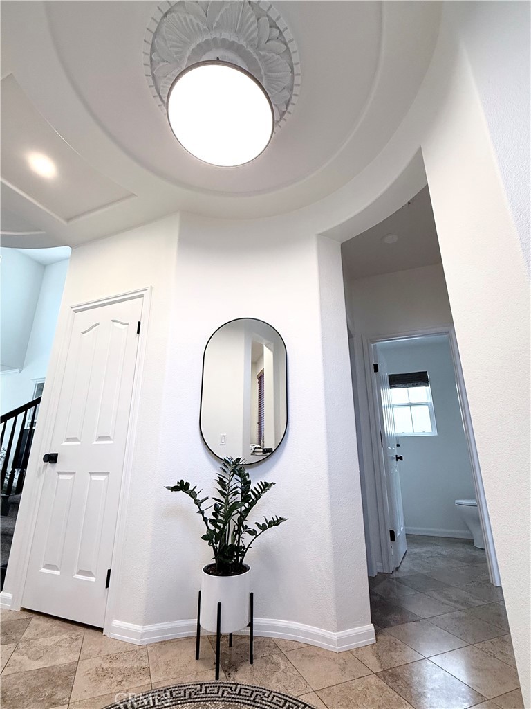 32 Marisol Newport Coast, CA 92657 - Photo 21 of 61 a room with wooden floor and potted plant