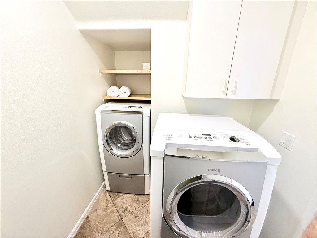 32 Marisol Newport Coast, CA 92657 - Photo 23 of 61 a utility room with dryer and washer