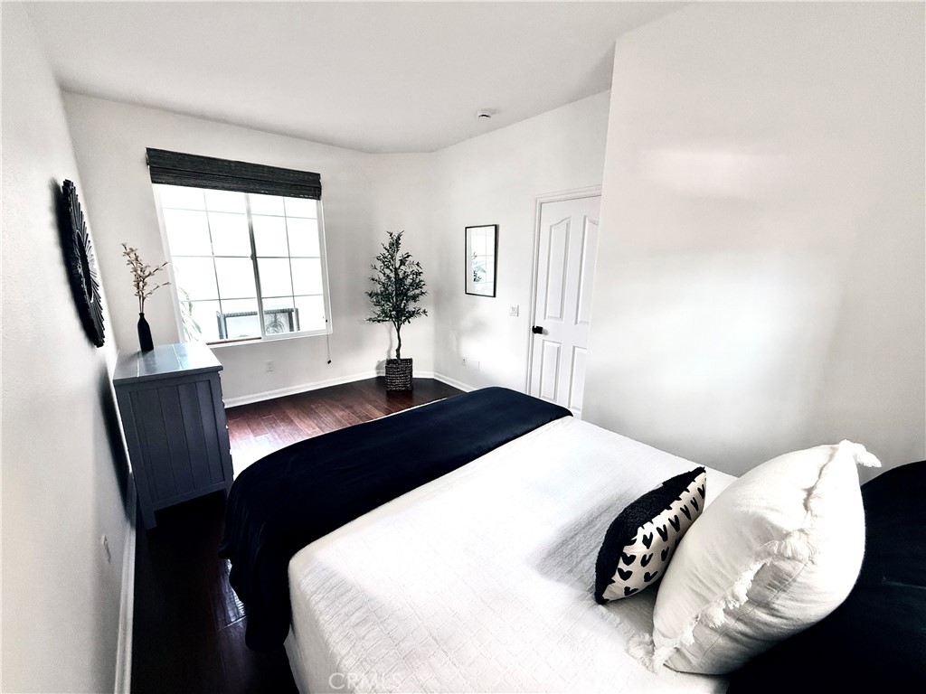 32 Marisol Newport Coast, CA 92657 - Photo 25 of 61 a bedroom with a bed and a window