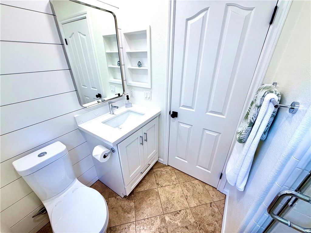 32 Marisol Newport Coast, CA 92657 - Photo 26 of 61 a bathroom with a sink and mirror with bathtub