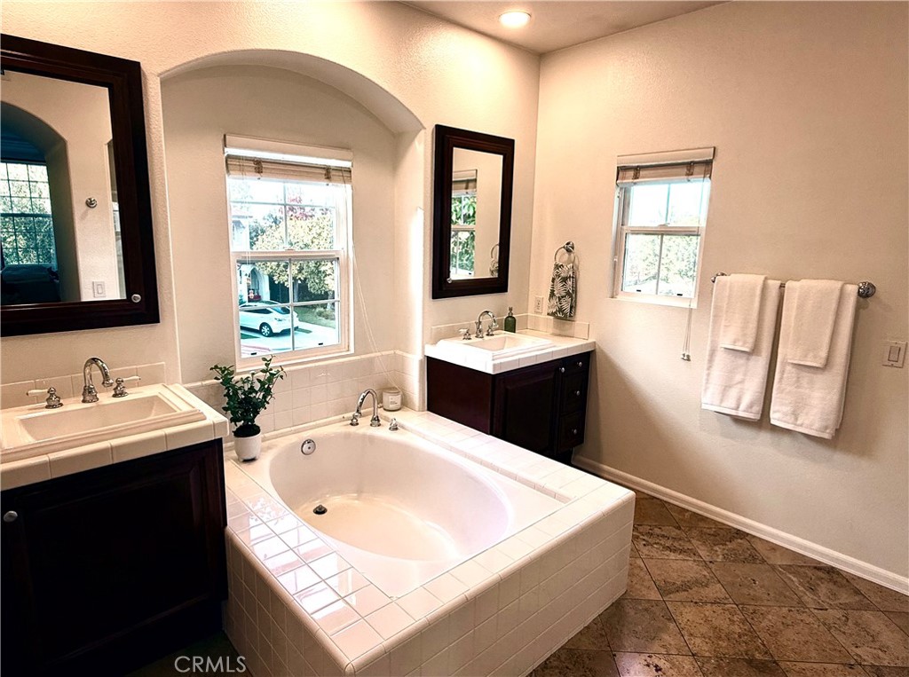 32 Marisol Newport Coast, CA 92657 - Photo 34 of 61 a bathroom with a tub sink and mirror