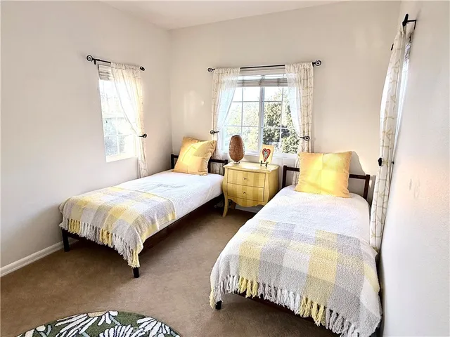 a view of staircase with wooden floor and wall painting