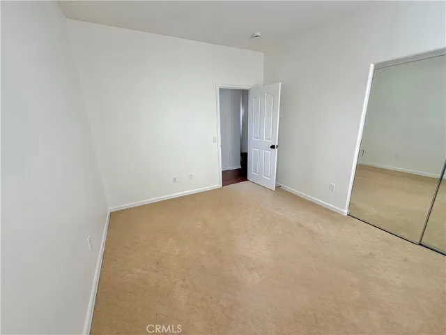 a view of a garden with flowers and trees