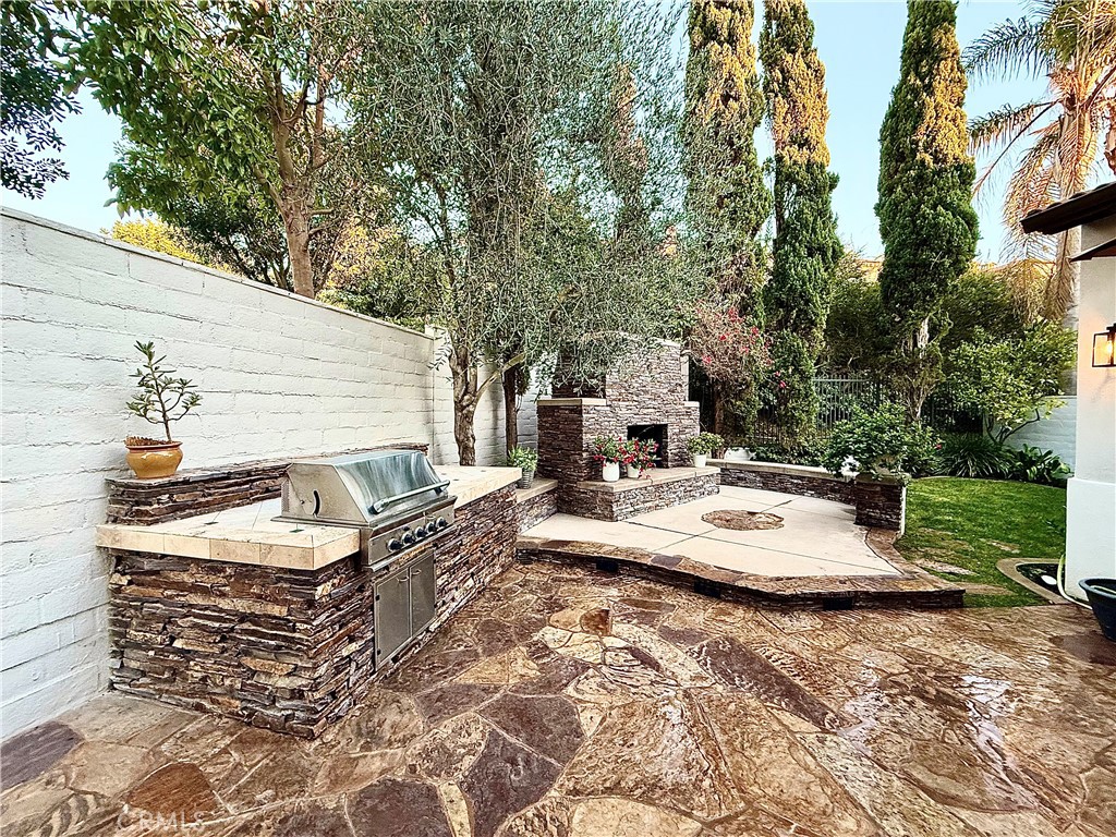32 Marisol Newport Coast, CA 92657 - Photo 51 of 61 a view of the patio with couches and table and chairs next to yard