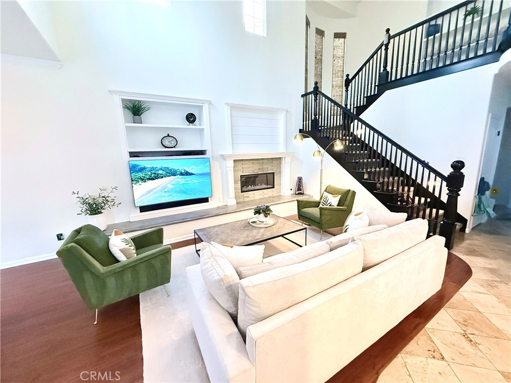32 Marisol Newport Coast, CA 92657 - Photo 8 of 61 a living room with fireplace furniture and a wooden floor