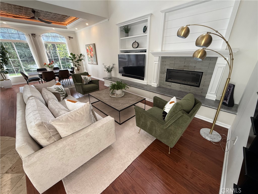 32 Marisol Newport Coast, CA 92657 - Photo 10 of 61 a living room with furniture flat screen tv and a fireplace