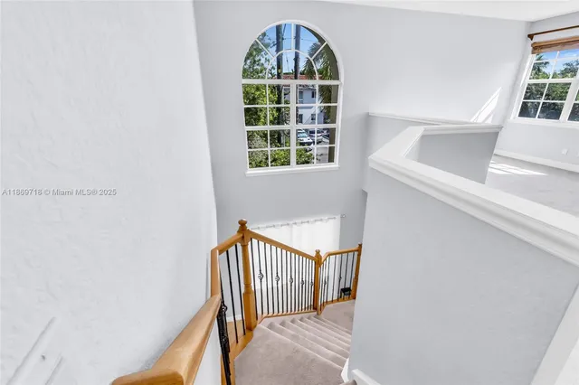 a view of entryway with wooden floor and a window