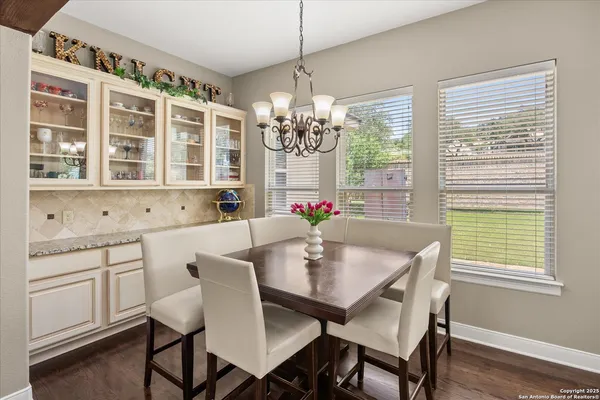 a view of a dining room with furniture and window
