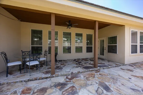 a front view of a house with patio