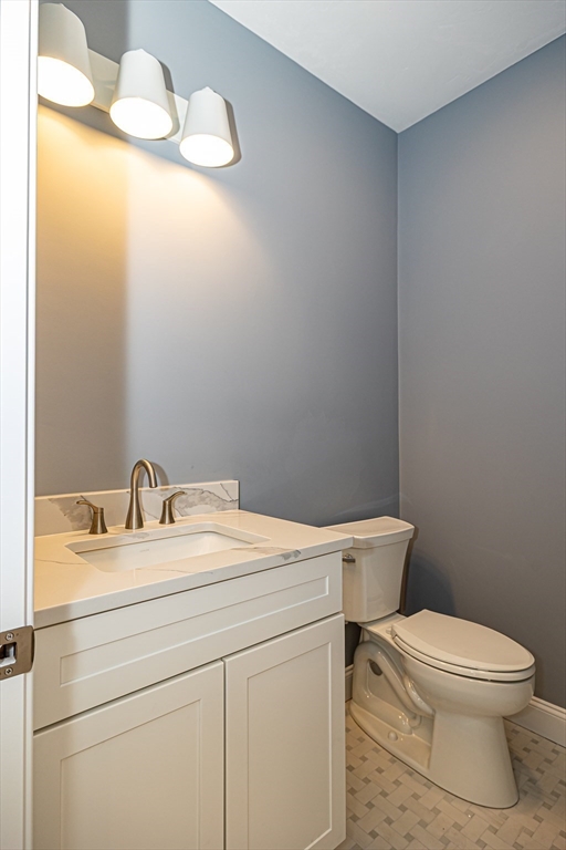 254 Concord Road, Unit LOT 2A Westford, MA 01886 - Photo 17 of 29 a bathroom with a toilet a sink and mirror