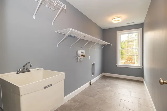 a view of utility room with closet