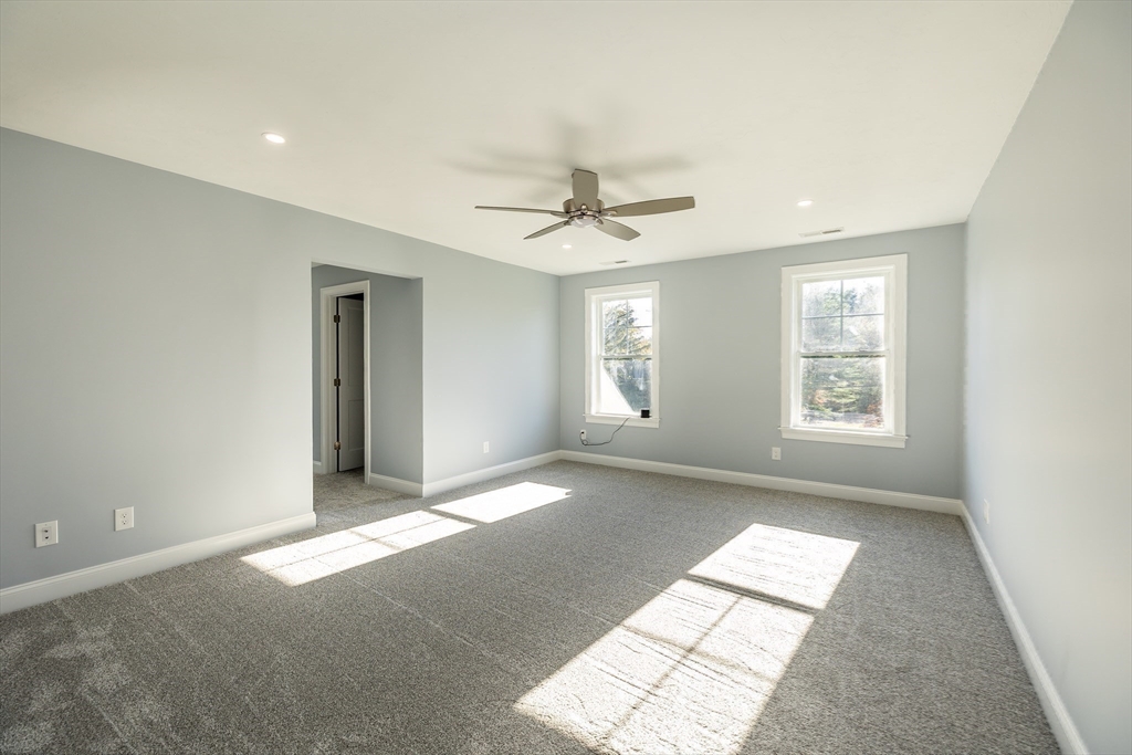 254 Concord Road, Unit LOT 2A Westford, MA 01886 - Photo 21 of 29 a view of livingroom with window and a ceiling fan