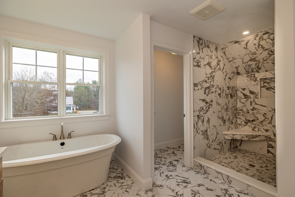 254 Concord Road, Unit LOT 2A Westford, MA 01886 - Photo 24 of 29 a bathroom with a bathtub and shower