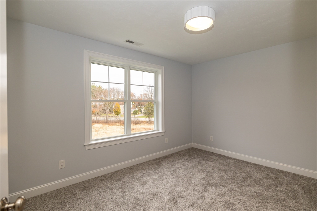 254 Concord Road, Unit LOT 2A Westford, MA 01886 - Photo 25 of 29 an empty room with a window