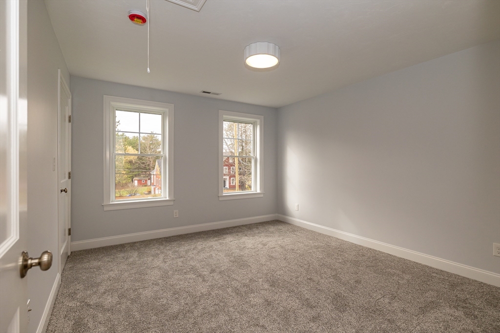 254 Concord Road, Unit LOT 2A Westford, MA 01886 - Photo 26 of 29 a big room with windows and closet