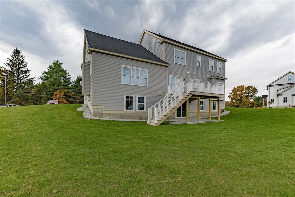 254 Concord Road, Unit LOT 2A Westford, MA 01886 - Photo 5 of 29 a view of a house with a yard