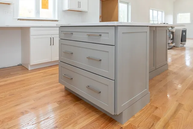 a view of a dresser with wooden floor