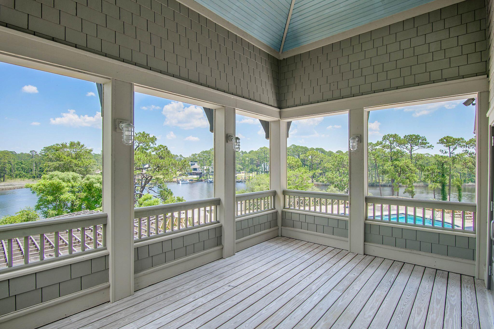 231 Turtle Cove Panama City Beach, FL 32413 - Photo 1 of 1 a view of a room with wooden floor and iron stairs