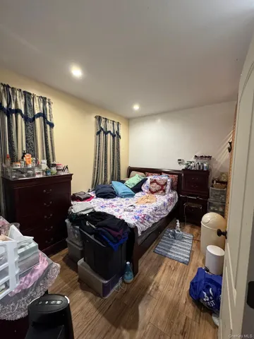 a bedroom with a bed and dresser
