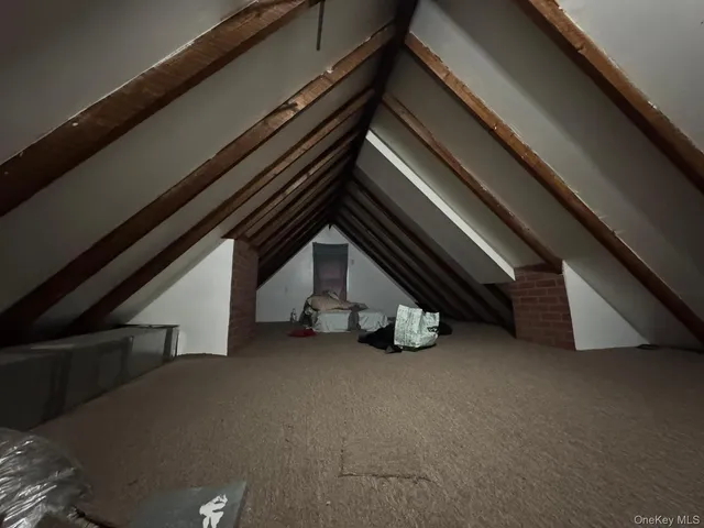 a view of an empty room with stairs