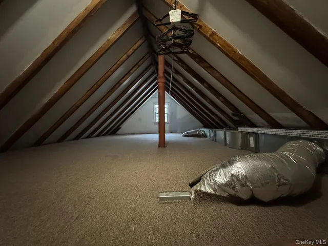 a view of backyard with a chair and table