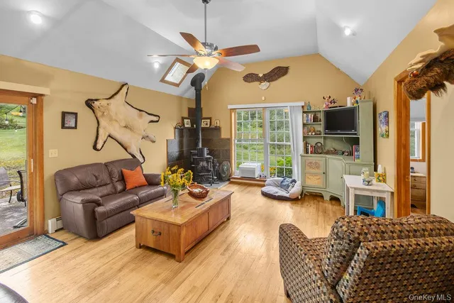 a living room with furniture fireplace and a flat screen tv