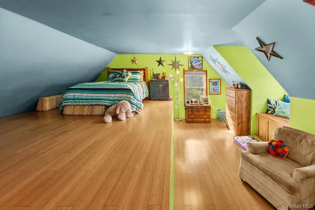 a living room with a bed and furniture