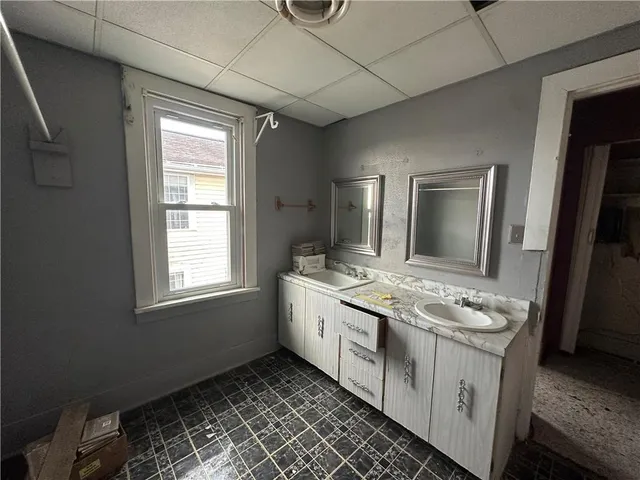 a view of a hallway with bathroom