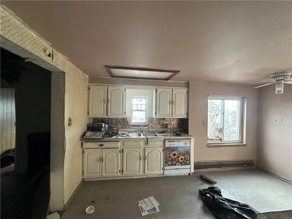 a kitchen with a stove and a refrigerator
