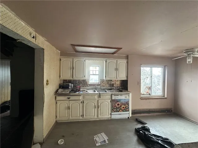 a kitchen with a stove and a refrigerator