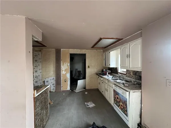 a kitchen with stainless steel appliances granite countertop a stove and a refrigerator