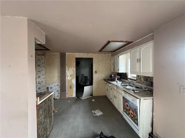 a kitchen with stainless steel appliances granite countertop a stove and a refrigerator
