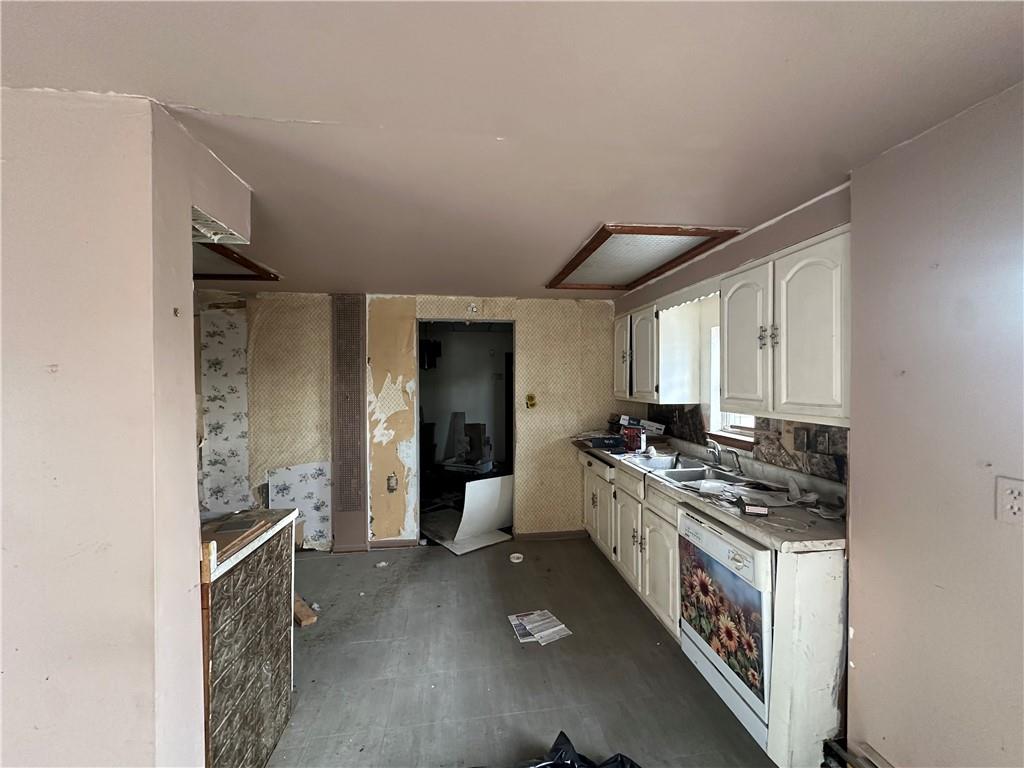 305 West 9th Avenue Tarentum, PA 15084 - Photo 6 of 22 a kitchen with stainless steel appliances granite countertop a stove and a refrigerator