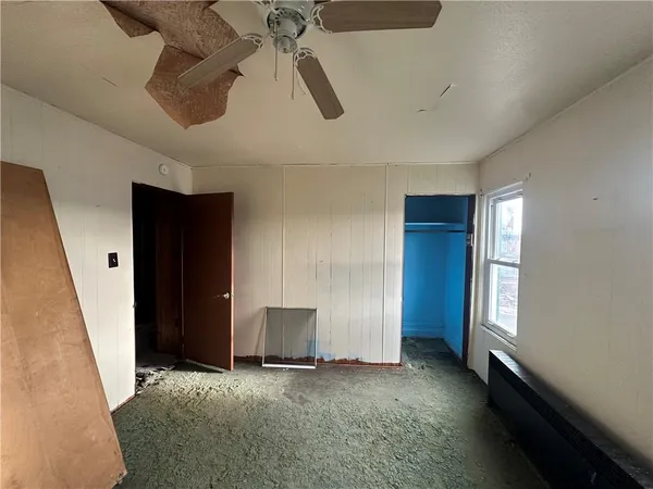 a view of empty room with windows