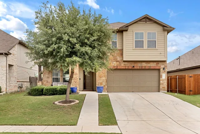a view of a backyard with sitting area and tub