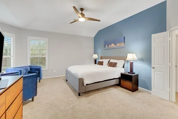 a bedroom with a bed and window