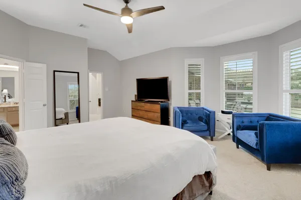 a bed room with a bed and a television