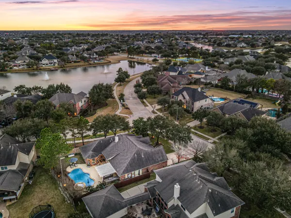 an aerial view of a house with a lake view