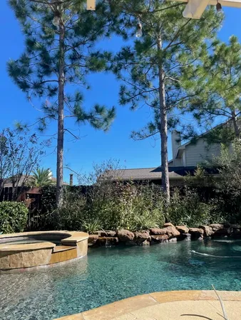 an aerial view of a house with outdoor space lake view and mountain view