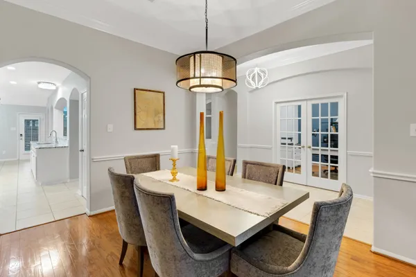 a view of a dining room with furniture and wooden floor
