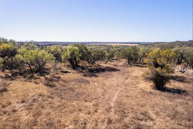 a living room with furniture a fireplace and a chandelier