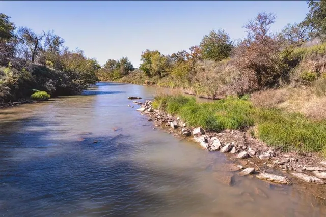 a view of a street with a garden