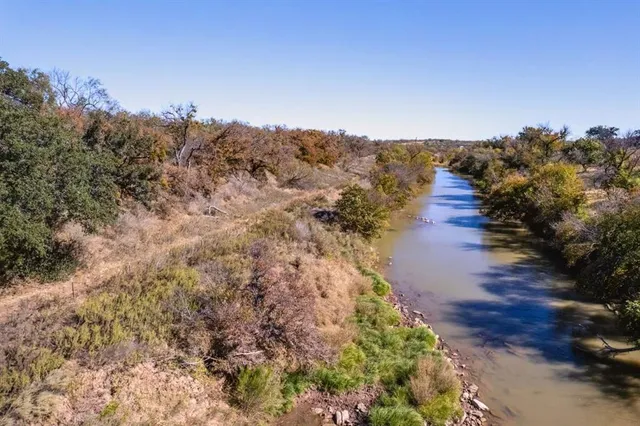 a view of a pathway with a yard