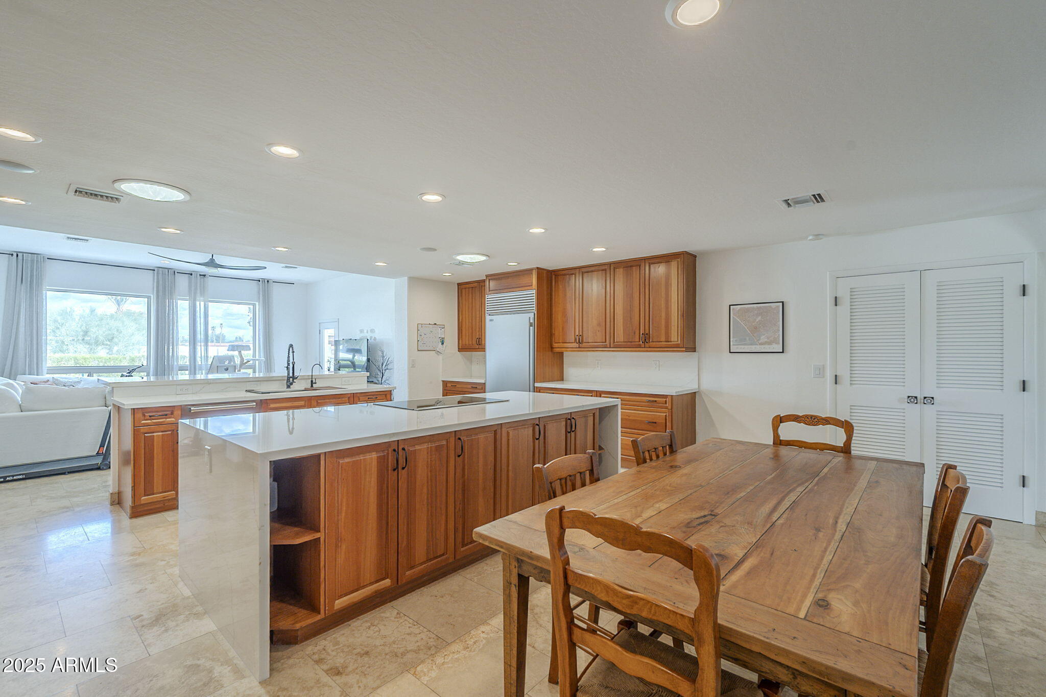 6302 East Cochise Road Paradise Valley, AZ 85253 - Photo 11 of 44 a large kitchen with kitchen island a sink table and chairs