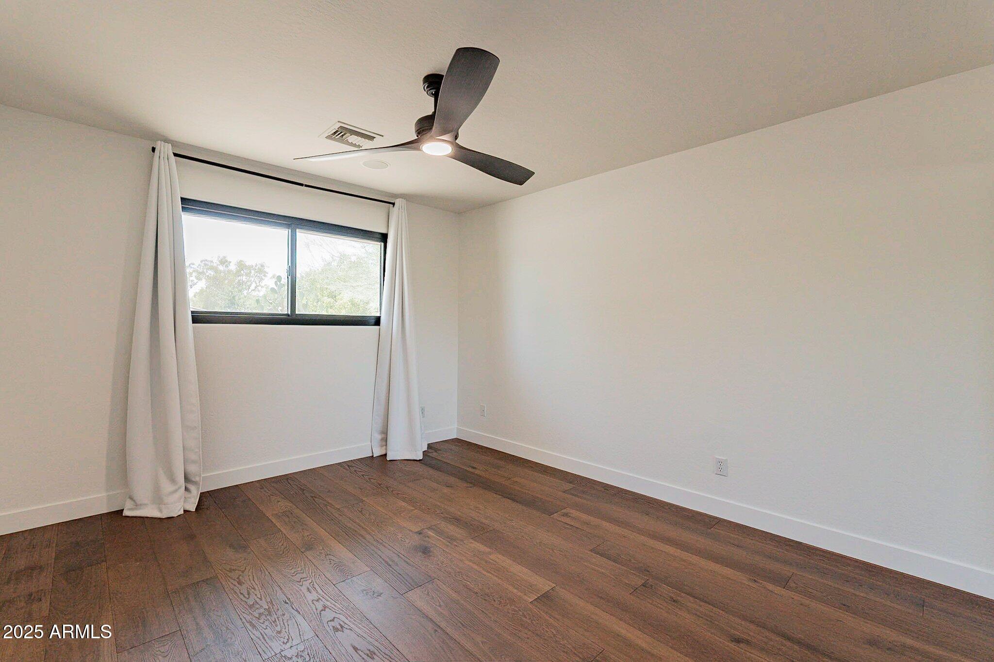 6302 East Cochise Road Paradise Valley, AZ 85253 - Photo 16 of 44 wooden floor in an empty room