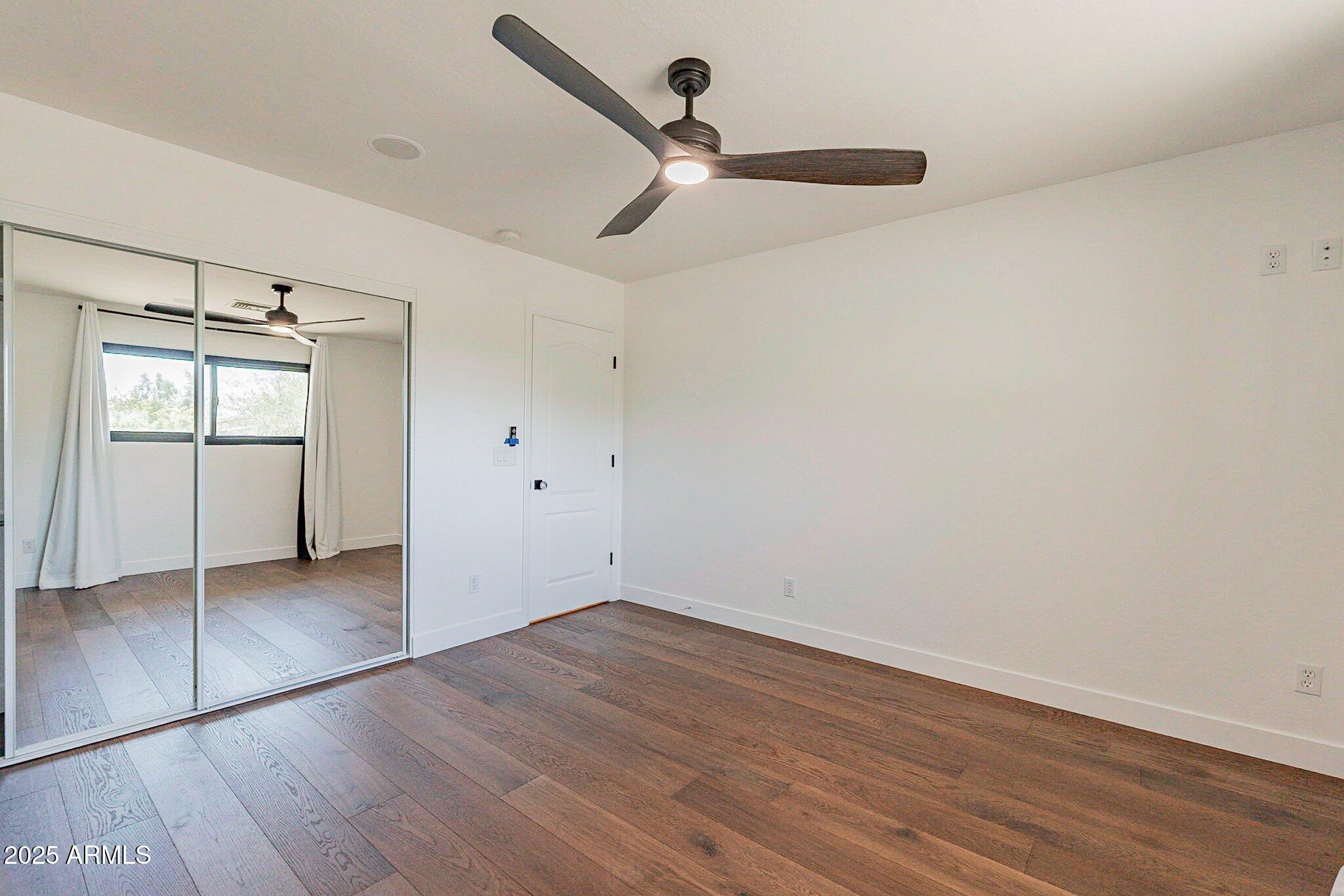 6302 East Cochise Road Paradise Valley, AZ 85253 - Photo 17 of 44 wooden floor in an empty room