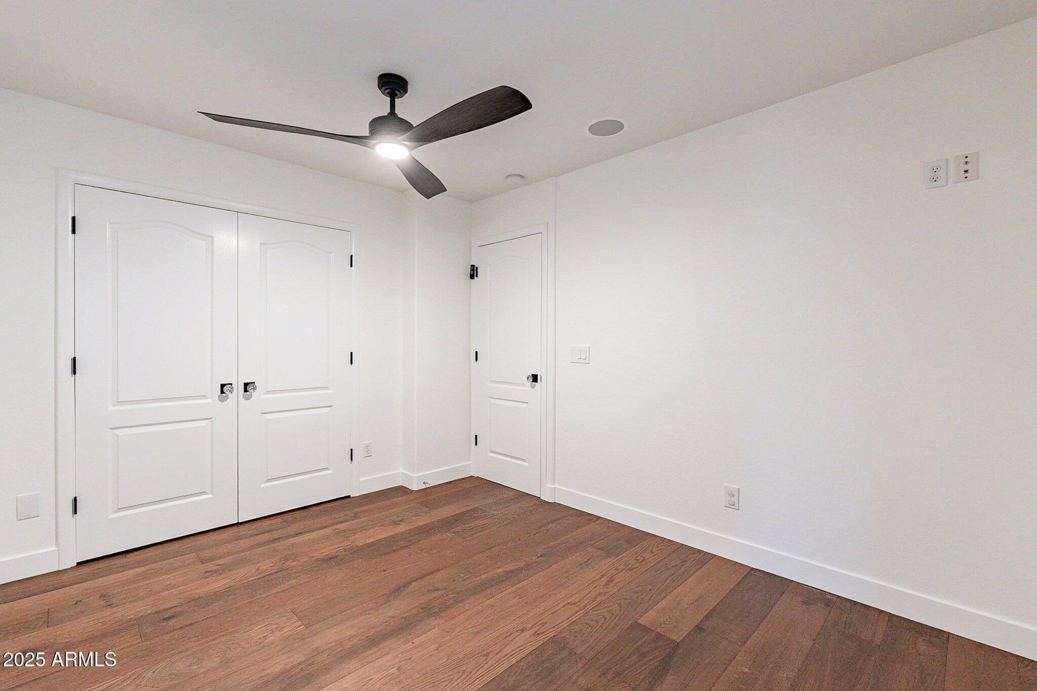 6302 East Cochise Road Paradise Valley, AZ 85253 - Photo 20 of 44 wooden floor in an empty room