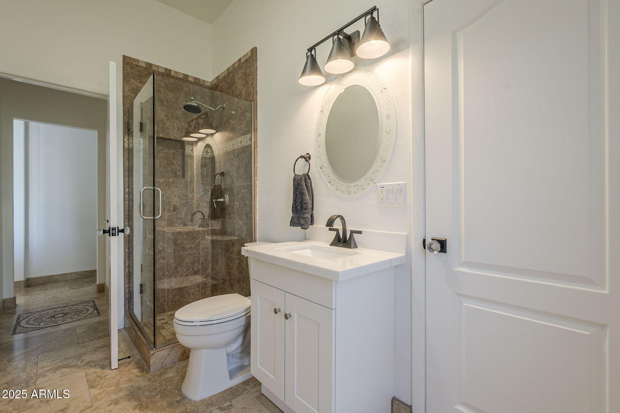 6302 East Cochise Road Paradise Valley, AZ 85253 - Photo 21 of 44 a bathroom with a toilet a sink and mirror