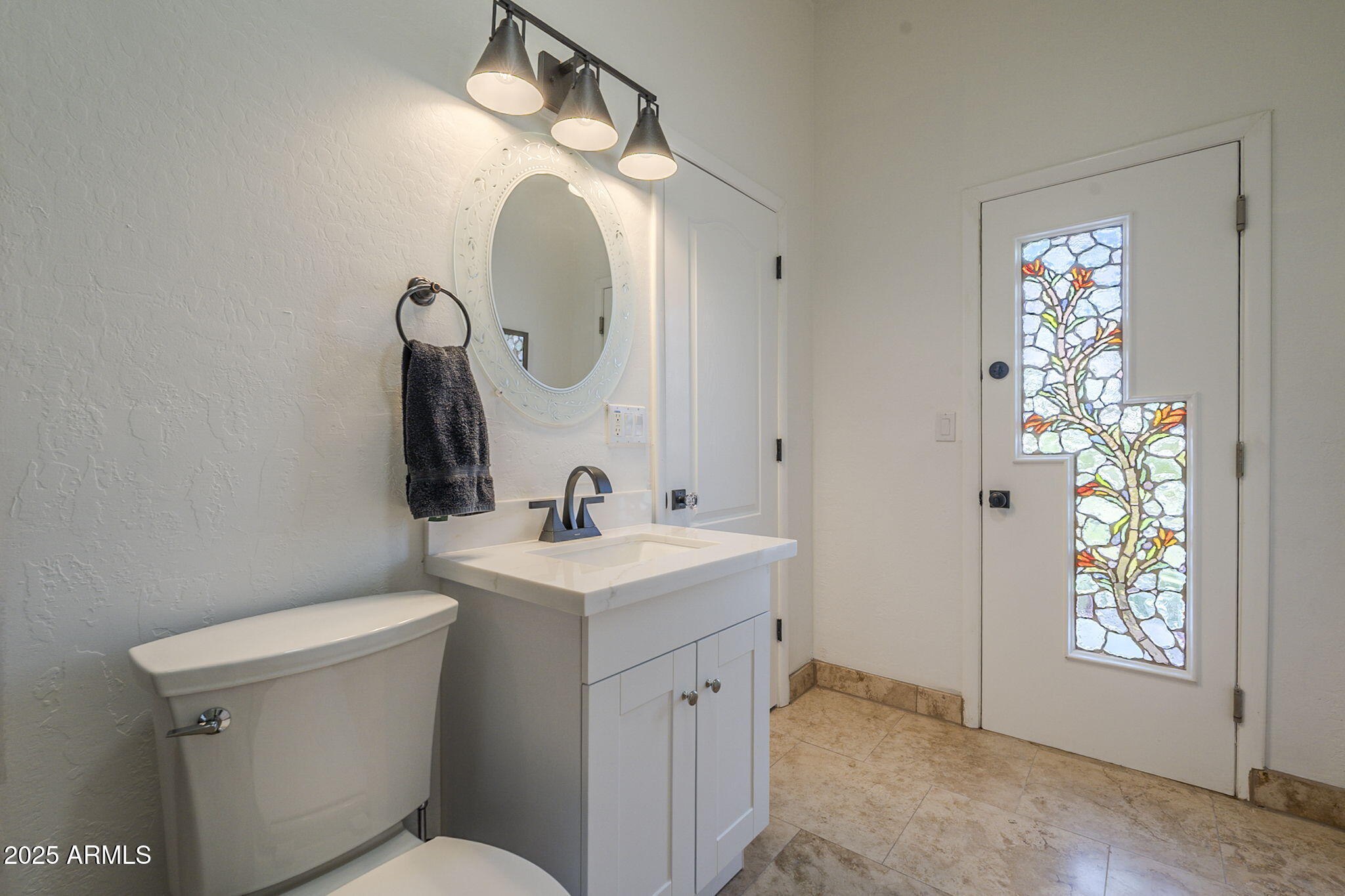 6302 East Cochise Road Paradise Valley, AZ 85253 - Photo 22 of 44 a bathroom with a toilet sink and mirror